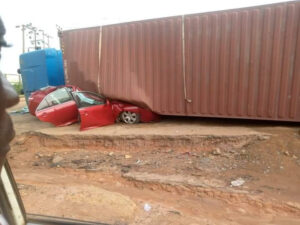 Occupants Escape Unhurt as Container Crushes Car | Daily Report Nigeria