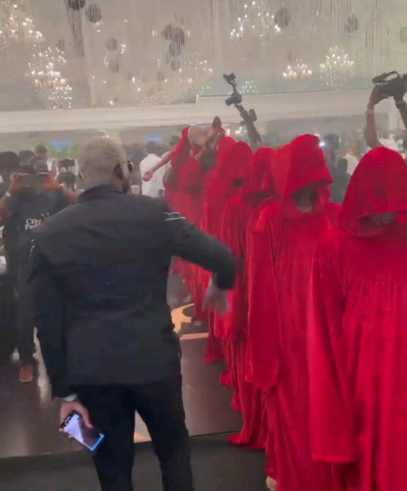 How Pretty Mike Stormed Lagos Party with Men Draped in Red Attire socialite pretty mike storms lagos party with men draped in red attire carrying another man who is almost naked photos videos 11261723539120543001