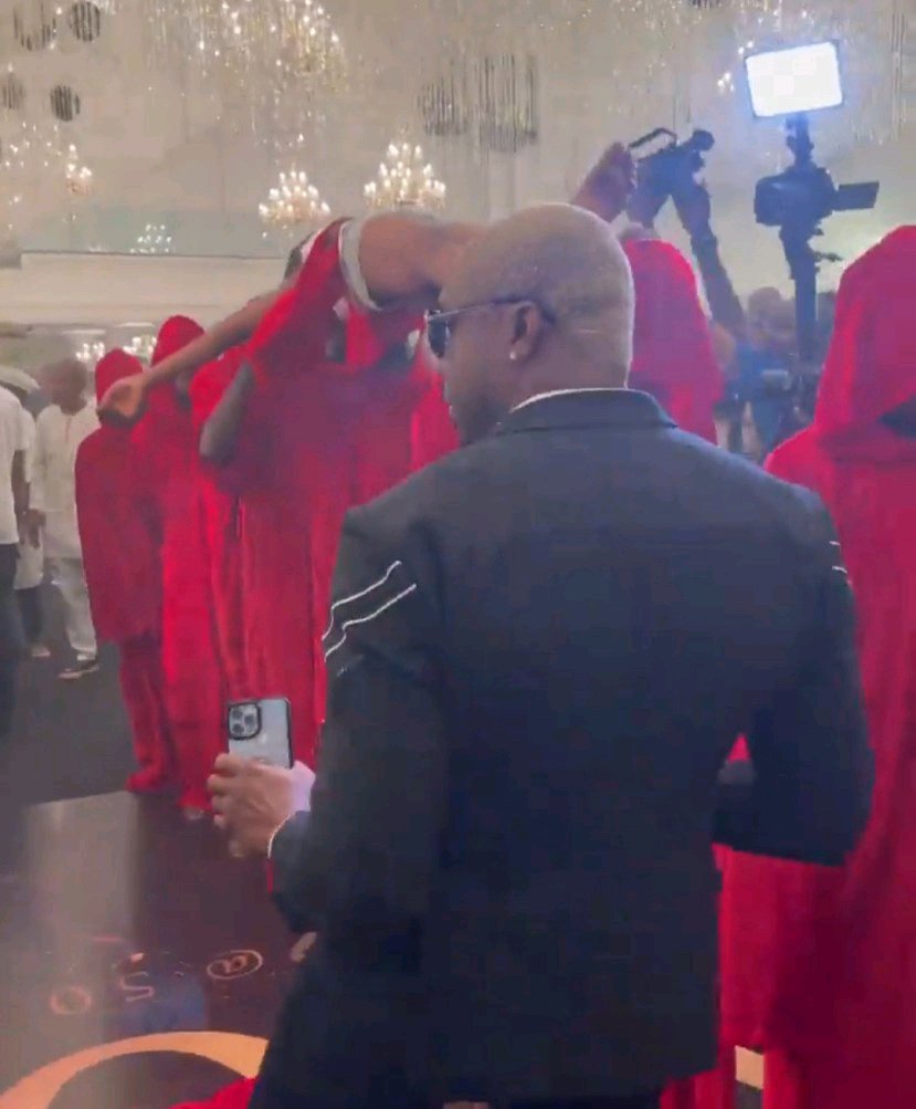 How Pretty Mike Stormed Lagos Party with Men Draped in Red Attire socialite pretty mike storms lagos party with men draped in red attire carrying another man who is almost naked photos videos 2356584426747199228
