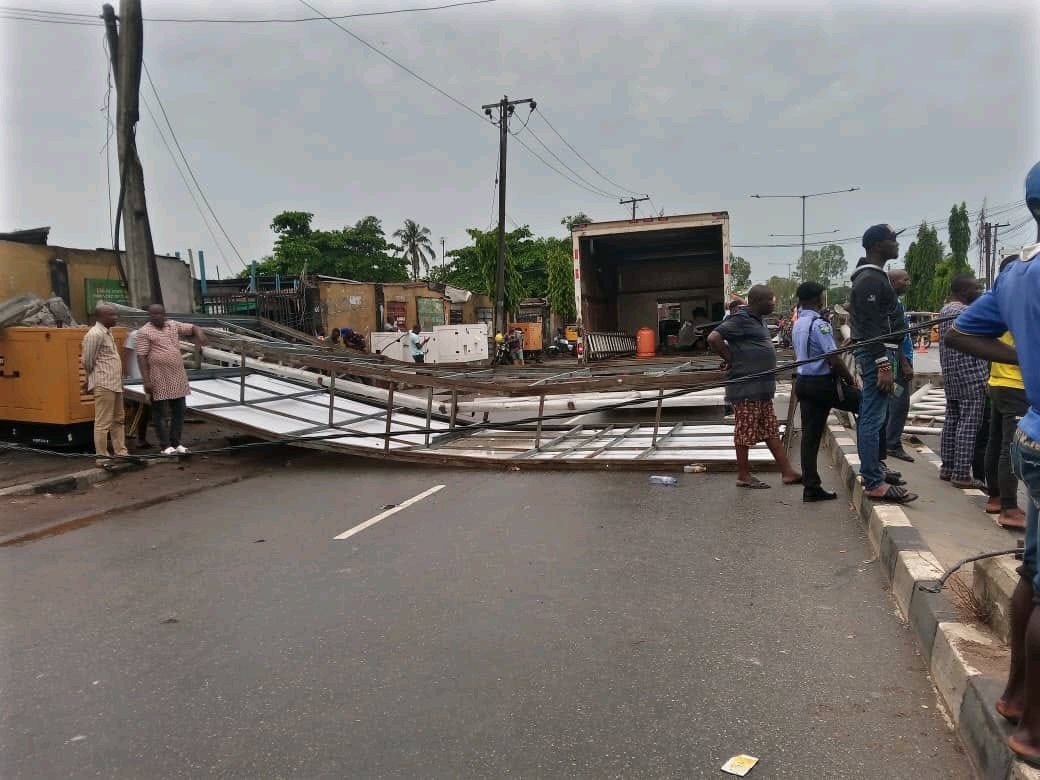 Huge Billboard Falls on Tricycle in Lagos | Daily Report Nigeria