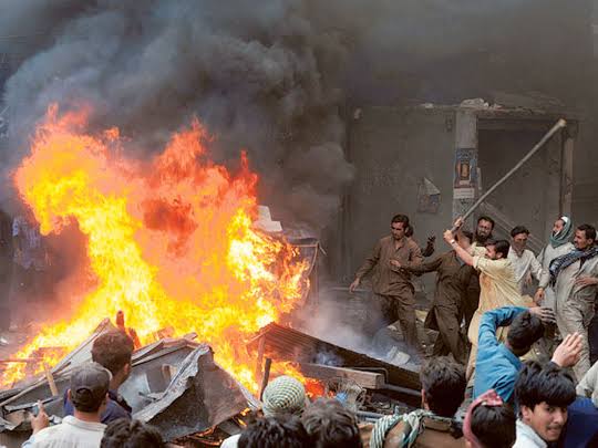 Hundreds of Muslim men set fire to churches and vandalised Christian homes during a rampage in eastern Pakistan on Wednesday