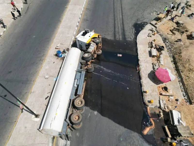 Residents Scoop Fuel, As Petrol Tanker Falls In Taraba Daily Report Nigeria Residents Scoop Fuel, As Petrol Tanker Falls In Taraba