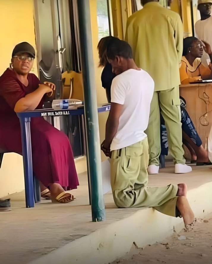 WAHALA: Corp Member Kneels, Serves Punishment Before An Official