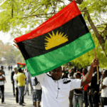 A supporter of Indigenous People of Biafra IPOB leader Nnamdi Kanu holds a Biafra flag during a rally in support of Kanu