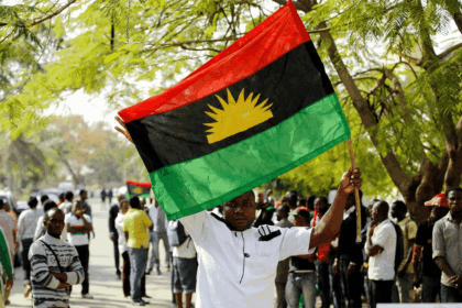 A supporter of Indigenous People of Biafra IPOB leader Nnamdi Kanu holds a Biafra flag during a rally in support of Kanu