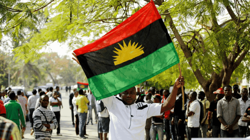 A supporter of Indigenous People of Biafra IPOB leader Nnamdi Kanu holds a Biafra flag during a rally in support of Kanu